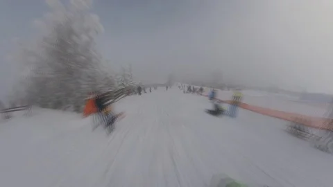 Sliding Down a Ski Slope POV with Snow and Trees on Foggy Sunny Day Fast Motion Video stock 124980662