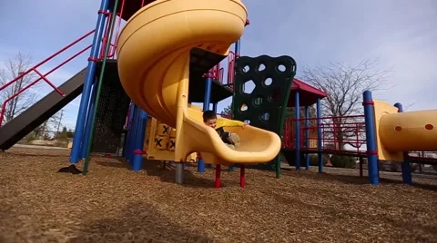 Sliding down a slide Stock Footage 50123890