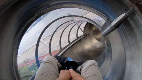 Sliding down a slide on a high rope course in china Video stock 106250784