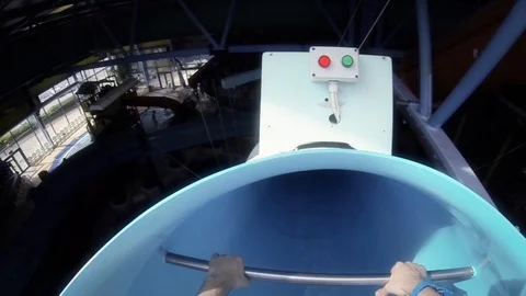 Sliding down a water slide at a water park Stock Footage 92129248