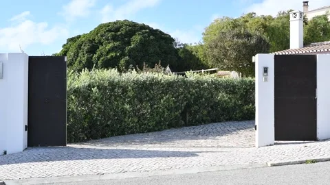 Sliding electric gate closing Stock Footage 274890537