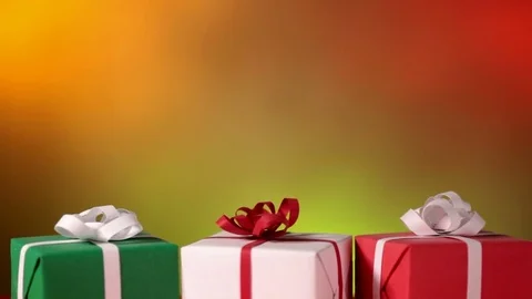 Sliding in front of christmas presents against blurry Stock-Footage 80949016