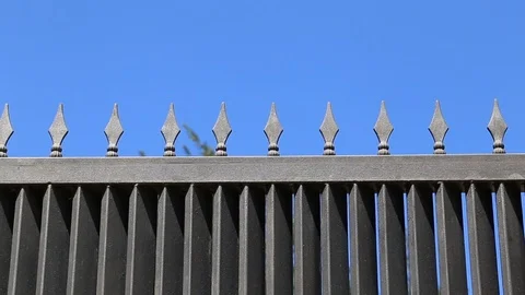 Sliding gate with spikes opening and closing. Loopable Stock Footage 102463868