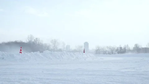 Sliding on an ice line. Snow drifting. Footage. Sport car racing on snow race Stock Footage 131817348
