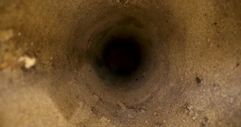 Sliding inside deep water well borehole in sandy soil Stock Footage 341489031