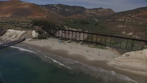 Sliding left past train bridge and out to end of pier 003718 DJI_0001 Video stock 90565774