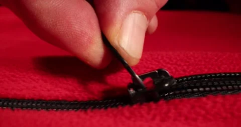 Sliding open the slider on a red material. Stock Footage 168251822