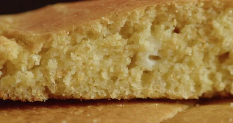 Sliding by the piece of cornbread 4K shallow DOF video Stock Footage 250685141