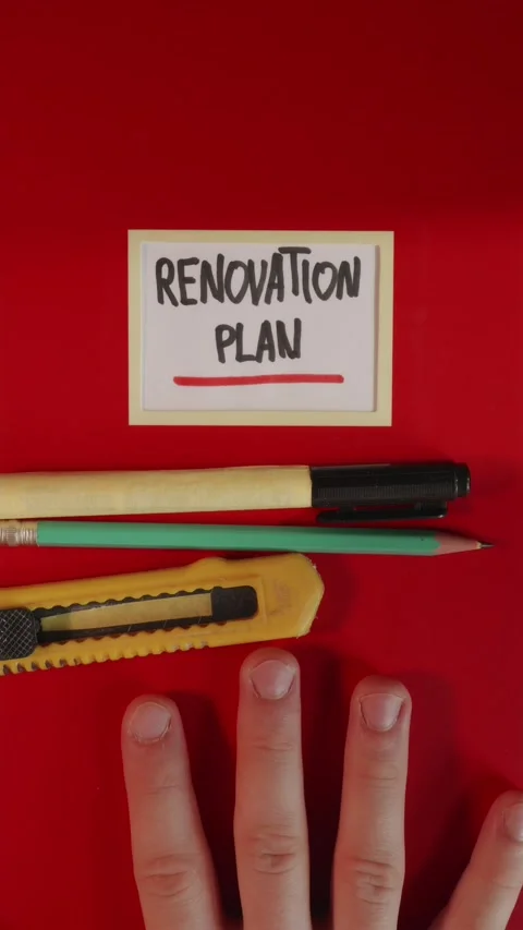 Sliding Renovation Plan notebook with tools into frame Stock Footage 341245984