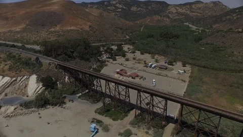 Sliding right past a train bridge 000800 DJI_0001 Stock Footage 90020486