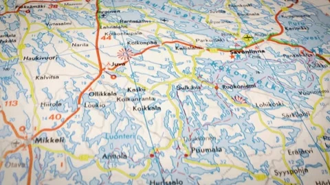 Sliding shot across road map showing lakes and fjords in Finland Stockbeeldmateriaal 332833532