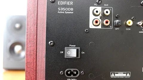 Sliding shot of the back of a speaker Stock Footage