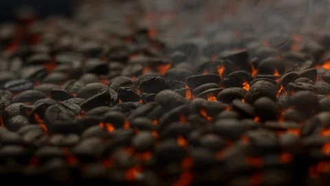Sliding shot of hot smoaking roasting coffe beans, close up Stock Footage 129493589