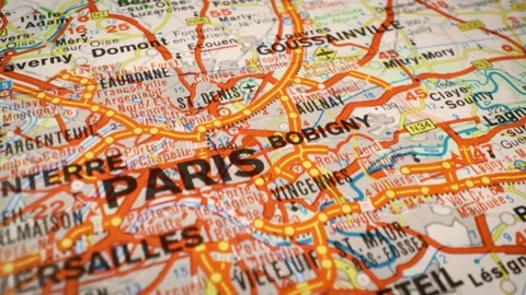 Sliding shot over road map highlighting network of roads leading to Paris Stockbeeldmateriaal 332833127