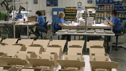 Sliding shot of a team of quality control specialists working in a Stock Footage 115699769