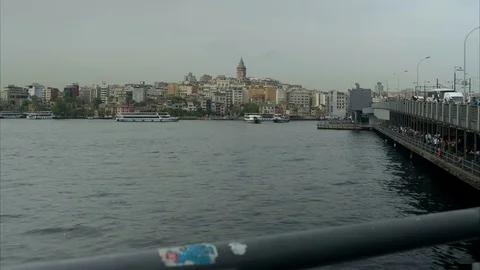 Sliding time lapse view of Istanbul Galata Tower and the bridge with a sea trans Stock Footage 82182201