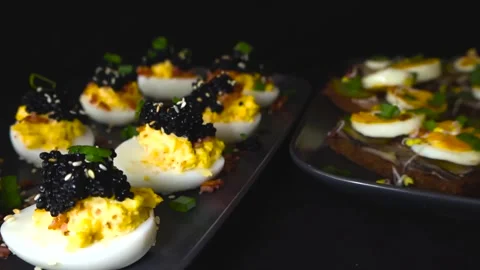 Sliding View of Luxury Deviled Eggs With Caviar Topping, Estonian Sprat 스톡 동영상 331769703