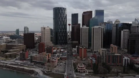 Slight Tilt-Down aerial of Calgary Tower, Downtown city skyline &amp; Centre Street Stock Footage 336354889