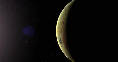 A slightly off-camera sun illuminates a crescent of Io's surface. Stock Footage 63804621
