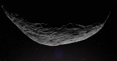 A slightly off-camera sun illuminates a crescent of Vesta's surface. Stock Footage 63806656