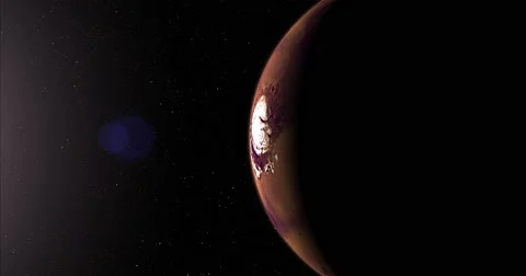 A slightly off-camera sun illuminates a crescent of Mars' North pole. Stock Footage 64064828
