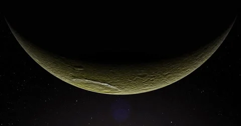 A slightly off-camera sun illuminates a crescent of Tethys' surface. Stock Footage 64065924