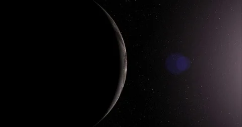 A slightly off-camera sun illuminates a crescent of Ganymede's surface.   Stock-Footage 78128343