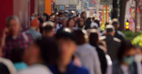 Slightly crowded sidewalk at Nathan Road in midday, blurred view Stock Footage 309364861