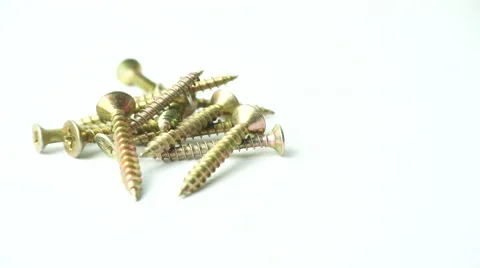 Slightly defocused and closeup of group of brass screw. Moving shot around. Stock Footage 41841411