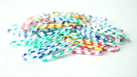 Slightly defocused and closeup of multi color paper clips. Moving shot around. Stock Footage 41841551