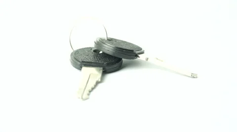 Slightly defocused and closeup of pair of keys. Moving shot around. Stock Footage 41841279
