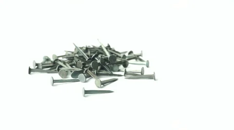 Slightly defocused and closeup of small black metal nail. Moving shot around. Stock Footage 41841203