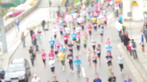 Slightly defocused front shot of people running at half Marathon event Stock Footage 36990093