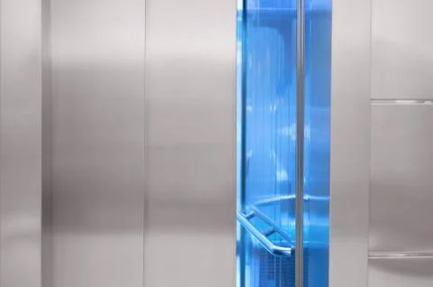 A slightly open elevator door in the mall. Fotos de archivo