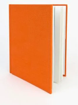 Slightly open orange book Fotos de archivo