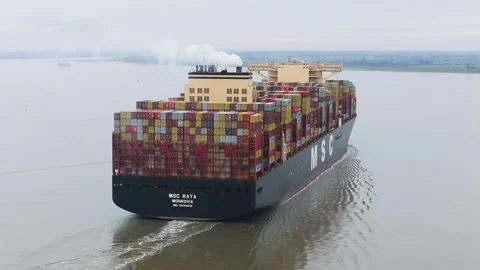 Slightly rear msc container ship raya cruising through dutch waters towering Stock Footage 328199251
