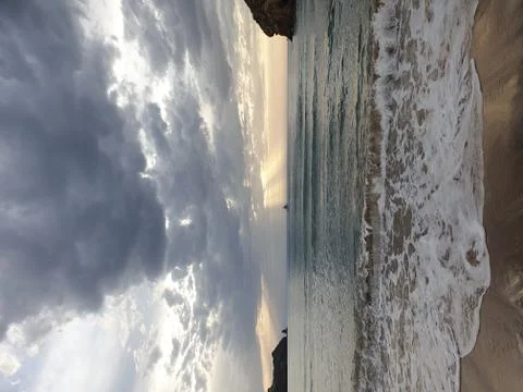 Slightly rough sea and cloudy weather Stock Photos