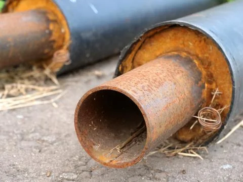 Slightly rusty pipe in thermal insulation Stock Photos