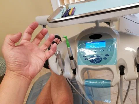 A slightly terrified patient going through the dreaded tooth drilling process Stock Photos