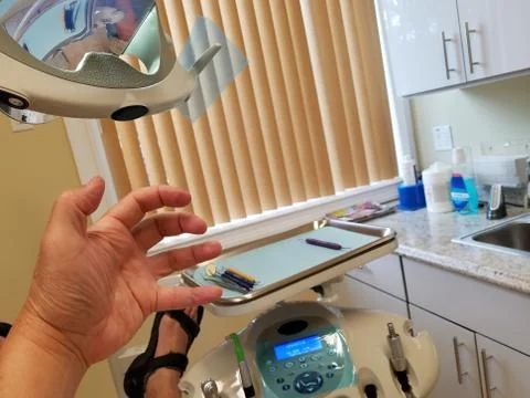 A slightly terrified patient going through the dreaded tooth drilling process Stock Photos