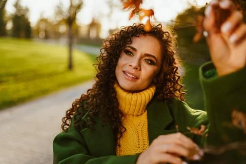 Slightly tilted sideways head looking with a slight smile and attention in the Stock Photos