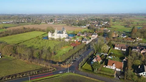 Slightly wider perspective castle centered within patchwork verdant pastures Video stock 329061419