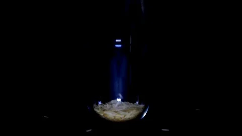 Slim and lengthy raw long grain rice in transparent glass on black background 스톡 동영상 75892164
