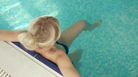 Slim blonde in the swimming pool Stock Footage 60140745