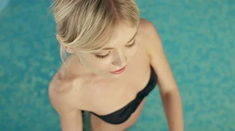 Slim blonde in the swimming pool Stock Footage 60170675