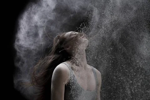 Slim blonde in white dust cloud portrait Slim blonde with her long hair lo... Stock Photos