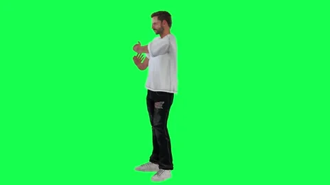 Slim criminal man in green screen with white t-shirt and black trousers, white t Video stock 248000141