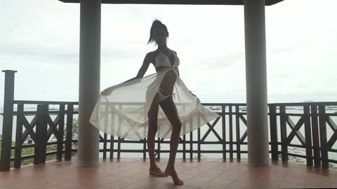 Slim Dancer in shadow with white background slowed motion Stock Footage 155780901