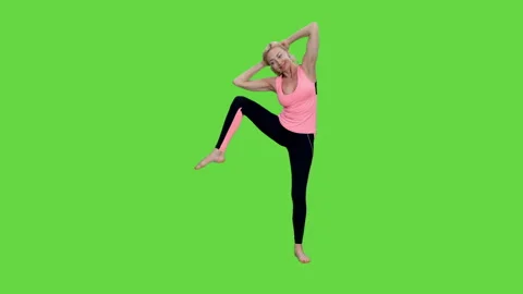 Slim fit middle aged smiling woman doing fitness exercises workout, chromakey Video stock 243745399