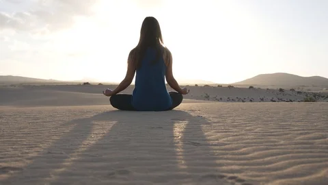 Slim girl doing breathing exercise at sunset wellness and fitness activity Stock Footage 125973295